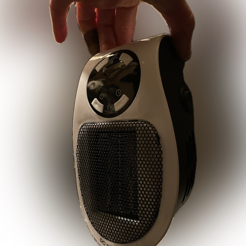 BNIB plug in portable wall heater w/remote 2 for $20